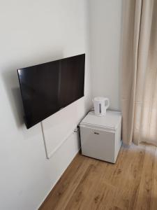 a flat screen tv hanging on a white wall at Adriatica in Zadar +45 photos