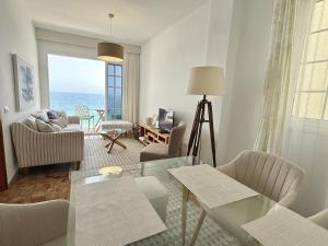 a living room with a view of the ocean at Casa Ale, Stunning Sea Views in Las Aguas