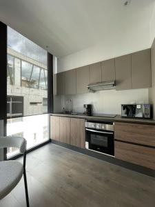HuamboyaQuito with a view - Condo in La Carolina的相册照片