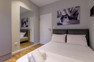 Postel nebo postele na pokoji v ubytování Mint - Lux Apt 2