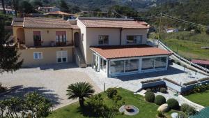 an aerial view of a house with a yard at B&B Capo al Piano in Marciana Marina