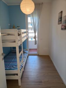 Ένα ή περισσότερα κρεβάτια σε δωμάτιο στο Appartamento VISTA MARE