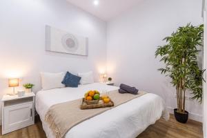 Postel nebo postele na pokoji v ubytování Deluxe Signature Studio - Malaga Center + 11 fotografií