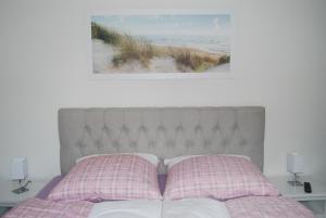 מיטה או מיטות בחדר ב-Haus Adria