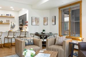 a living room with a table and chairs at 118 Villa Montane in Avon
