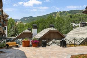 a group of buildings with mountains in the background at 118 Villa Montane in Avon
