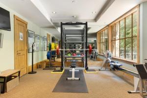 a fitness room with a gym with weights and equipment at 118 Villa Montane in Avon