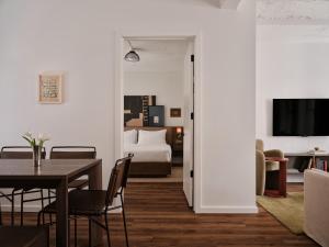 a dining room with a table and a bedroom at Mint House Washington Dc Downtown By Kasa in Washington, D.C. +28 photos