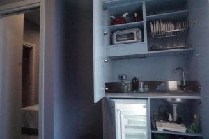 Η κουζίνα ή μικρή κουζίνα στο Paradise Luxury Apartments