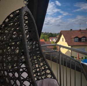 a close up of a metal object on a balcony at Ferienwohnung am Wald 2 in Sappenfeld +4 photos