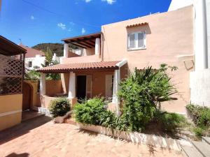 a house with a brick driveway in front of it at Eoliando Case per Vacanze - Lipari Mare in Lipari