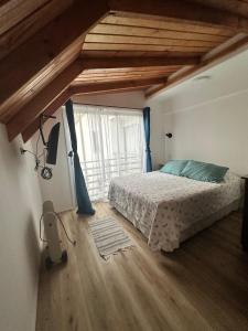 Voodi või voodid majutusasutuse Apart Hotel Colors toas