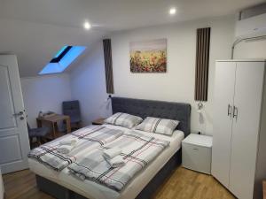 Postel nebo postele na pokoji v ubytování Apartmani D&D