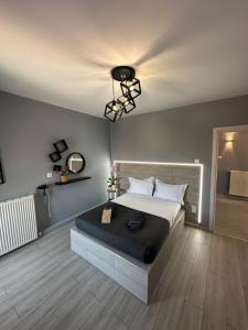 a bedroom with a large bed and a ceiling at Asteris luxury house in Polygryos