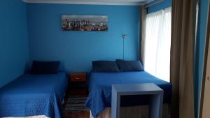 Voodi või voodid majutusasutuse Apart Hotel Colors toas