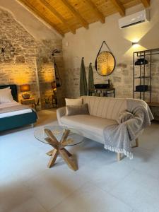 a living room with a couch and a table at The Hideaway - Kastel Novi in Kaštela