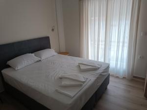 Postel nebo postele na pokoji v ubytování ARETI