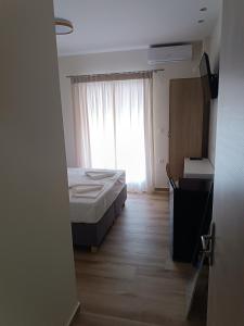 Postel nebo postele na pokoji v ubytování ARETI