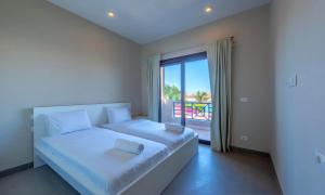 Giường trong phòng chung tại Luxury Stays in Sabina El Gouna