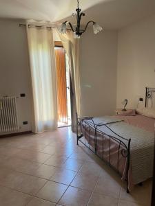 Ένα ή περισσότερα κρεβάτια σε δωμάτιο στο Tenuta Santella