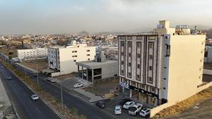 an aerial view of a city with buildings and a street at Qimam Park Abha 4 in Abha