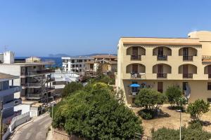 an apartment building in a city with buildings at Nura's - Casa El Trò in Alghero