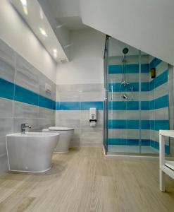 a bathroom with two sinks and a shower at Finestra sul mare Diamante in Diamante