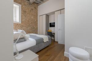 Katil atau katil-katil dalam bilik di Il Parione Luxury Apartment with view, Florence