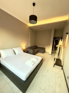 En eller flere senge i et værelse på Plaza Vista