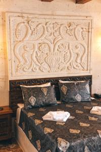 Postel nebo postele na pokoji v ubytování Nest Cappadocia Hotel