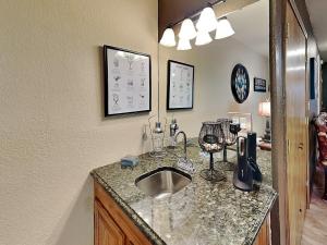 a kitchen with a counter with a sink at Innsbrook 254 in Ruidoso