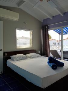 Postel nebo postele na pokoji v ubytování Marazul Dive Apartment F1