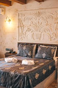 Postel nebo postele na pokoji v ubytování Nest Cappadocia Hotel