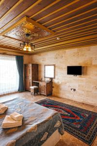 TV a/nebo společenská místnost v ubytování Nest Cappadocia Hotel