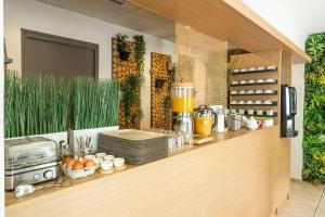 a kitchen with a counter with a blender on it at Sure Hotel by Best Western Mont-de-Marsan in Saint-Pierre-du-Mont