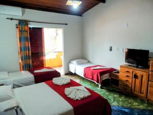 Ένα ή περισσότερα κρεβάτια σε δωμάτιο στο O Pharol Hostel e Pousada