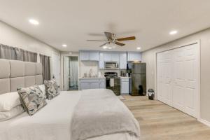 a bedroom with a large bed with a ceiling fan at Private Yard: Pet-Friendly Studio in New Boston! in New Boston