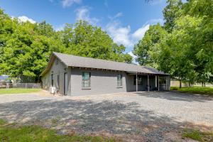 a small house with a driveway in front of trees at Private Yard: Pet-Friendly Studio in New Boston! in New Boston