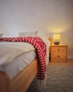 Ένα ή περισσότερα κρεβάτια σε δωμάτιο στο vila Barbara - Vysoké Tatry