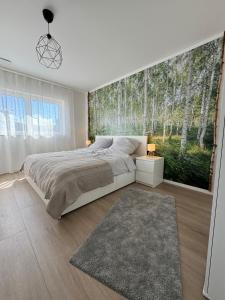 Ένα ή περισσότερα κρεβάτια σε δωμάτιο στο Zu Hause im Birkenwald