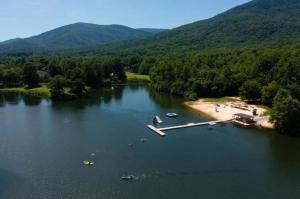 an aerial view of a lake with boats and a beach at Dobie 48 with Wintergreen Advantage in Wintergreen