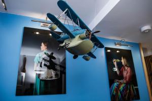 a small plane hanging from a wall in a room at ApArt 2 Luxury 3BR Apartment Free Parking Sleeps 6 in Bedford
