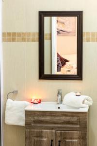 a bathroom with a sink and a mirror at Valhalla on Knelsby in Hillcrest +56 photos