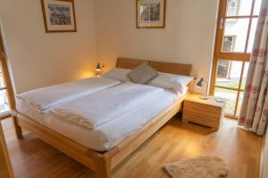 Ένα ή περισσότερα κρεβάτια σε δωμάτιο στο Johanna 4 by SMR Rauris Apartments - near Spa and Gondola +49 φωτογραφίες