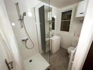 a bathroom with a shower and a toilet at Séjour à Melun AppartHôtel de la Médiathèque in Melun