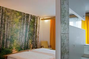 Un pat sau paturi într-o cameră la Hotel Erbprinzenhof