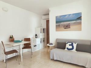 a bedroom with a bed and a desk and a table at Stunning Intimate views. Terrace Rooftop. Wifi in Tamariu +31 photos