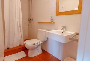 a bathroom with a toilet and a sink at T5 · Cozy Retreat 50m to Beach Garden Escape in Tamariu