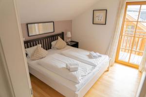 Posteľ alebo postele v izbe v ubytovaní Eva Maria 7 by SMR Rauris Apartments - inc Spa and near Gondola