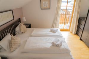 Posteľ alebo postele v izbe v ubytovaní Eva Maria 7 by SMR Rauris Apartments - inc Spa and near Gondola
